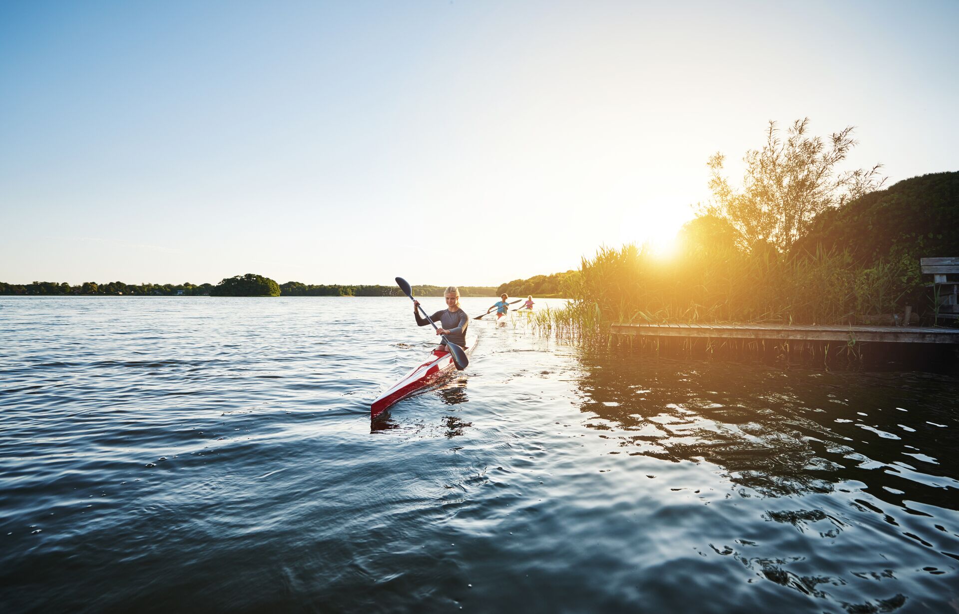 A person paddling a kayak. 