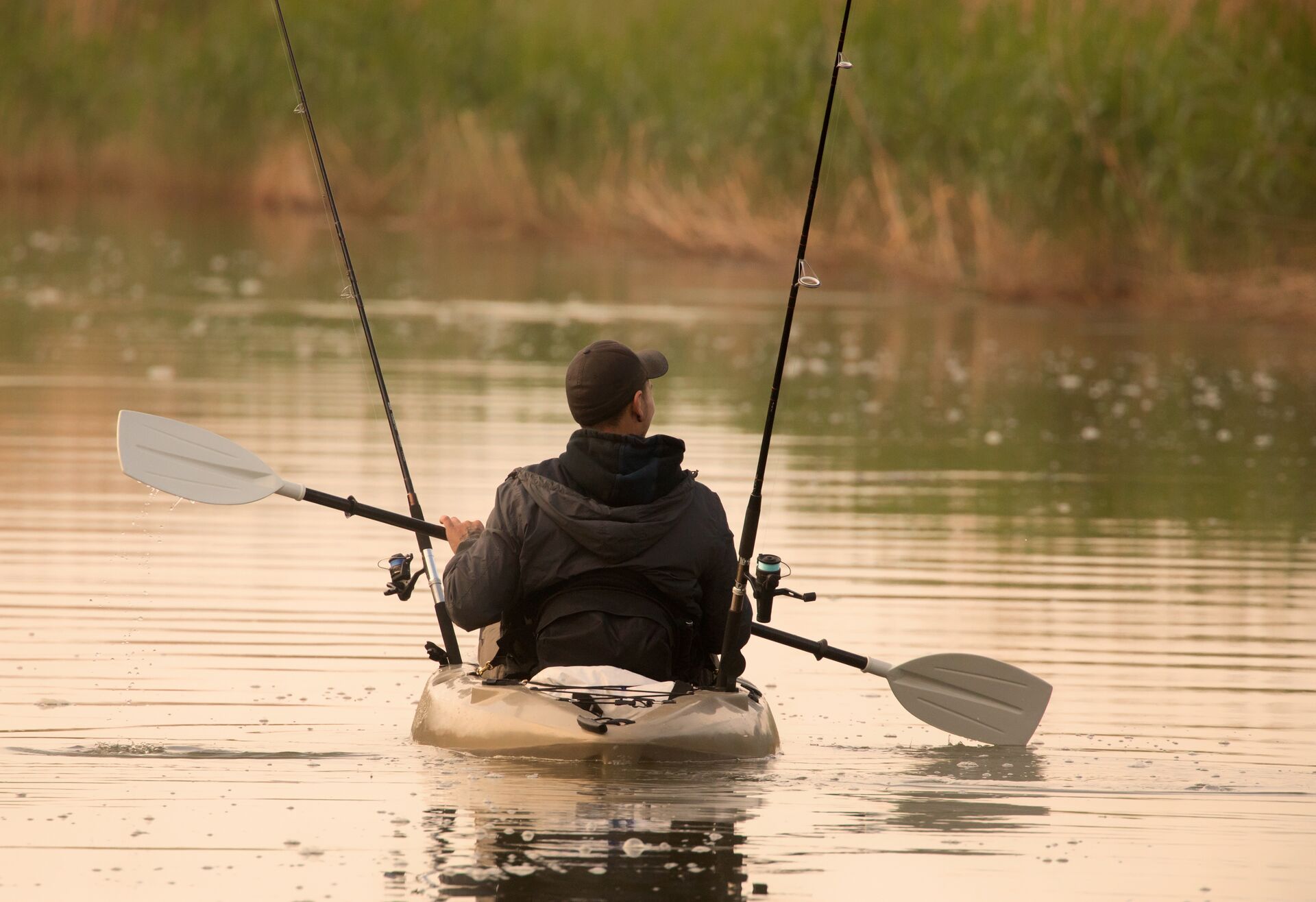 A man in a kayak on the water. 