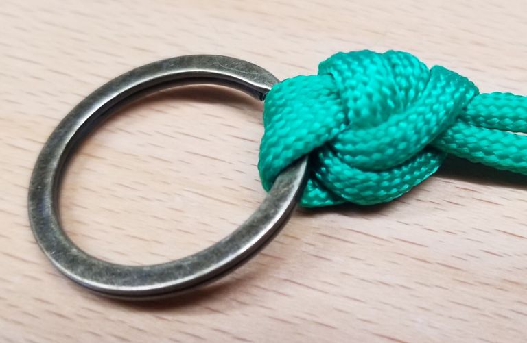 Close-up of a palomar knot on a table. 