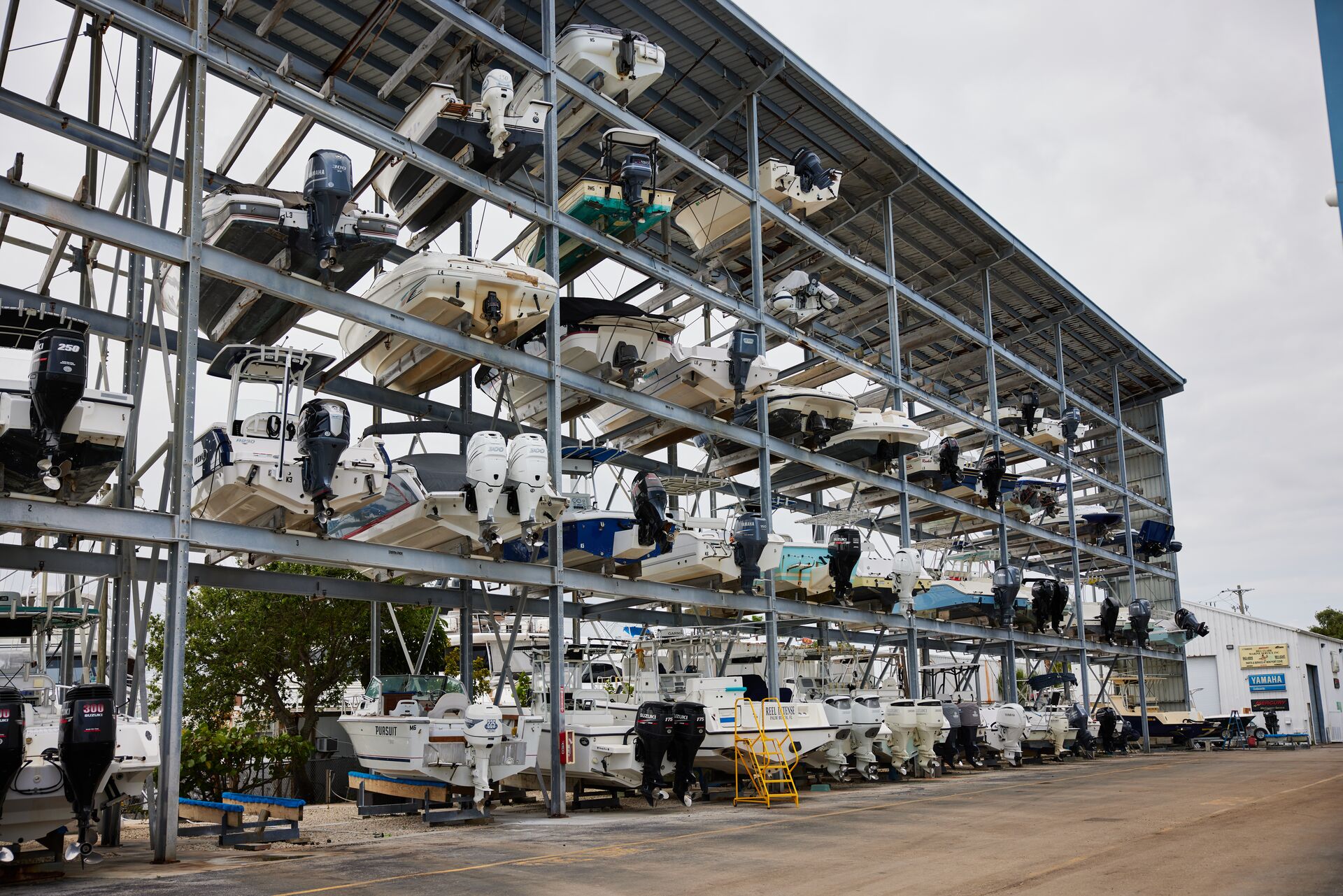 Boats out of the water stored on big shelves, how to winterize a boat concept. 