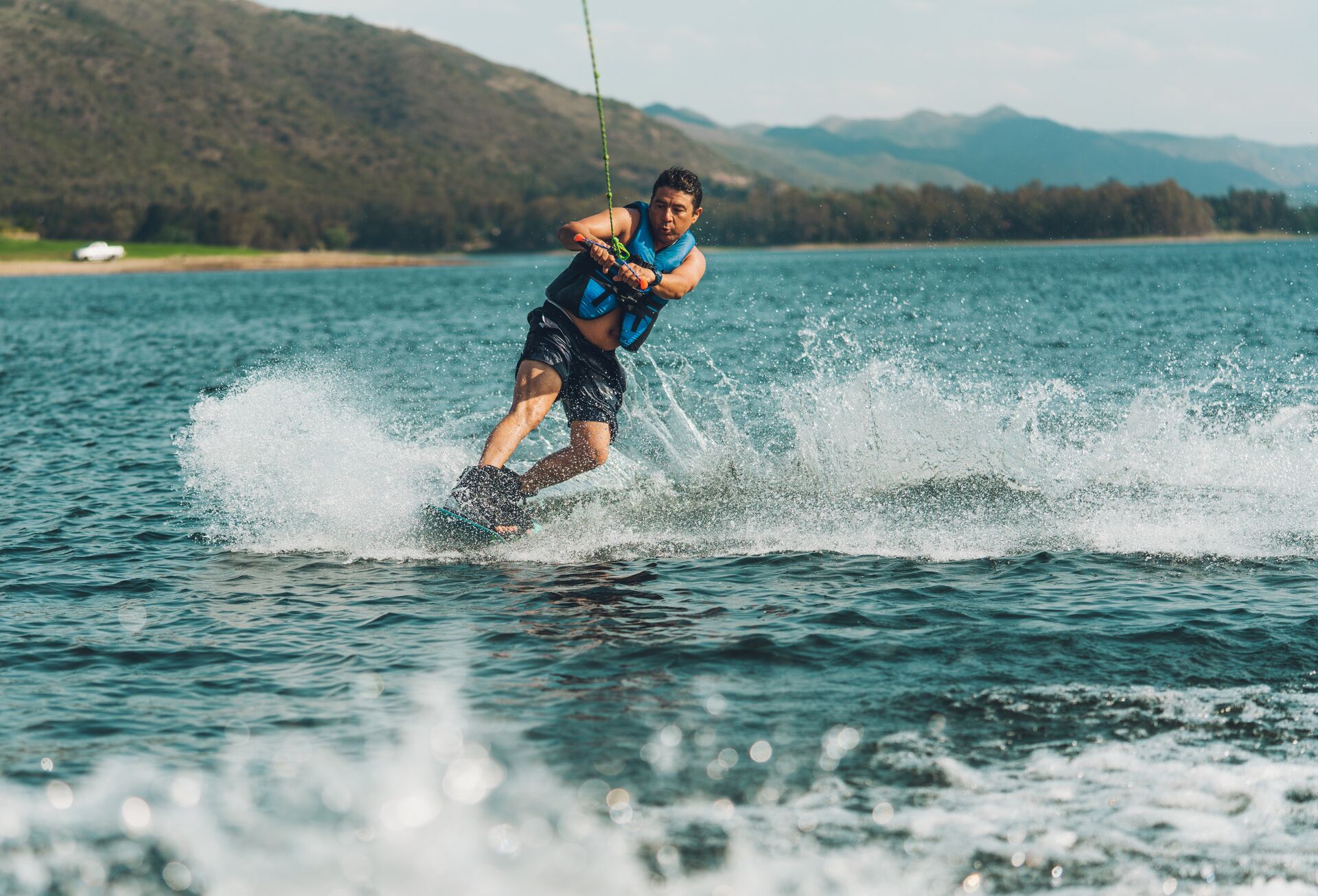 A man on a waterski on the water behind a boat, avoid boat propeller injuries concept. 