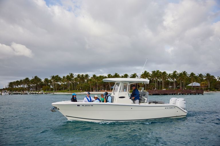 The port side of a boat traveling on the water.