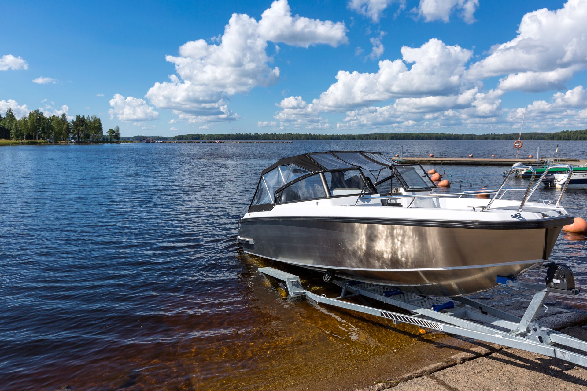 A boat on a trailer going into the water, how to launch a boat by yourself concept. 