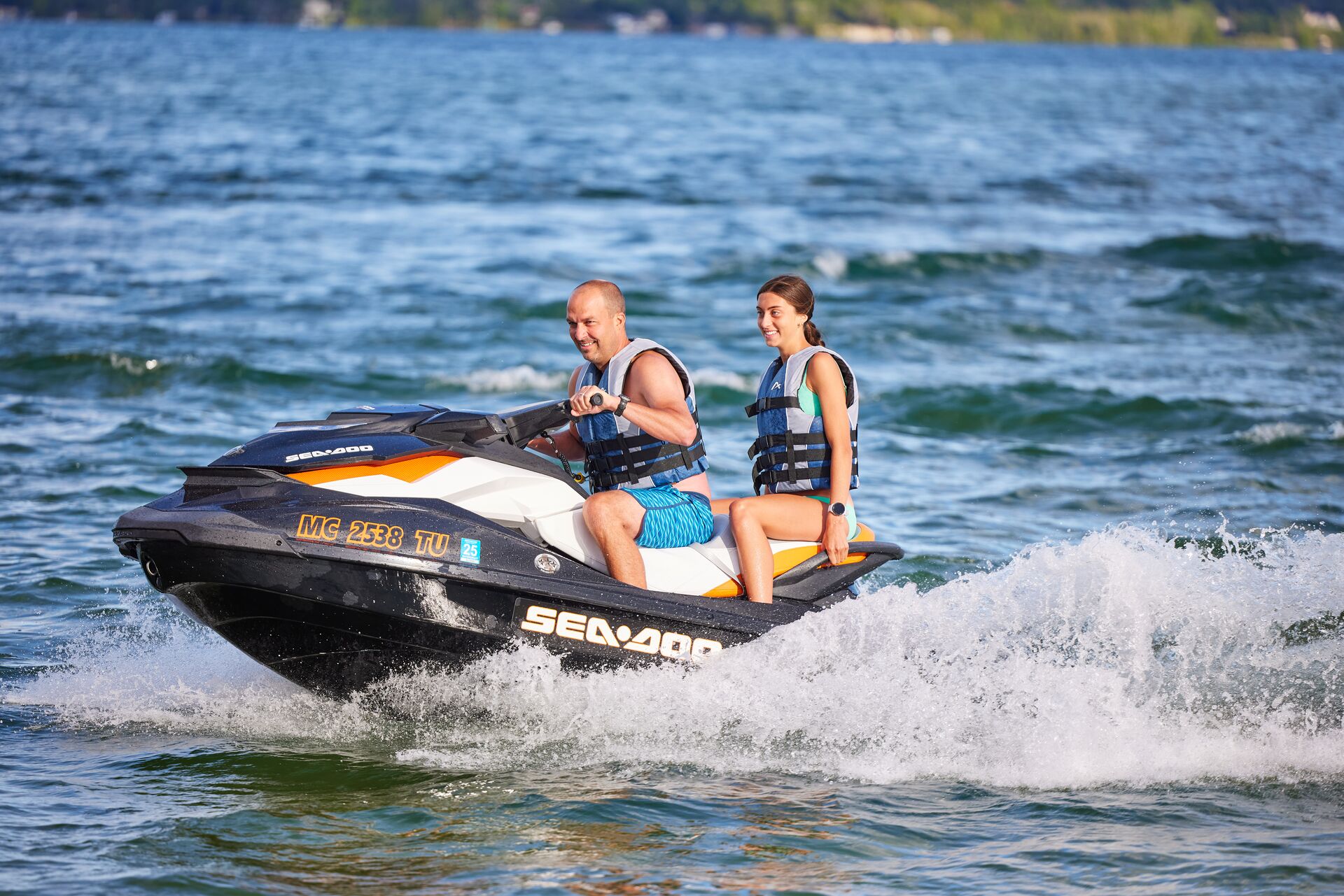 A man and girl on a PWC, is a jet ski considered a boat concept. 